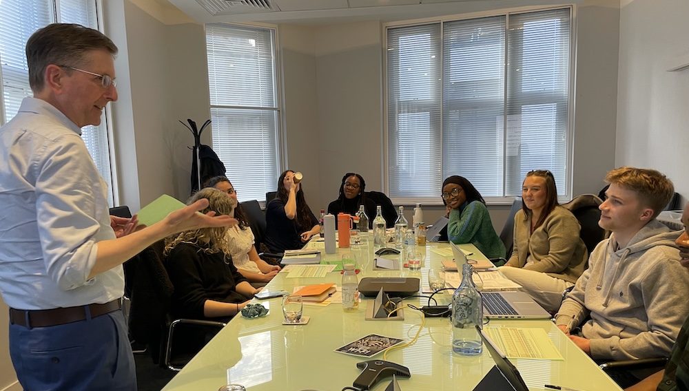 David with some trainee freelancers sitting around a table