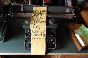 A typewriter with the notice accountants used ultra wide machines for early spreadsheets