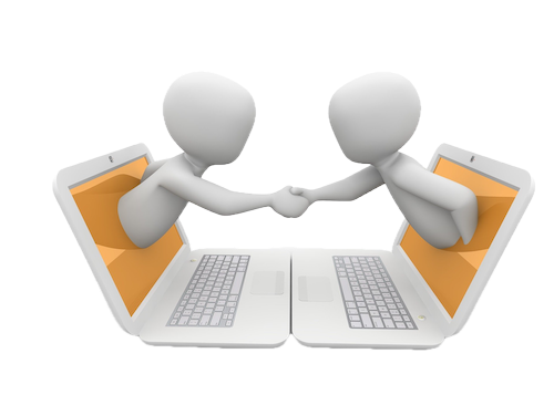 Two people shaking hands through their laptop screens